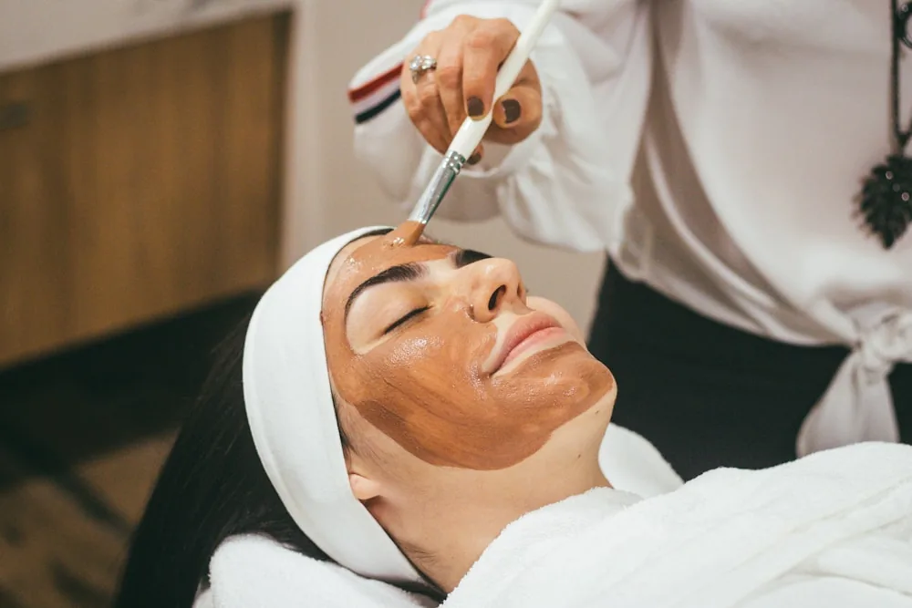 Facial treatment being applied