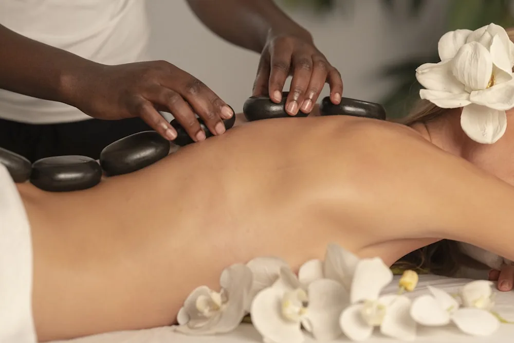 Hot stone treatment with orchids