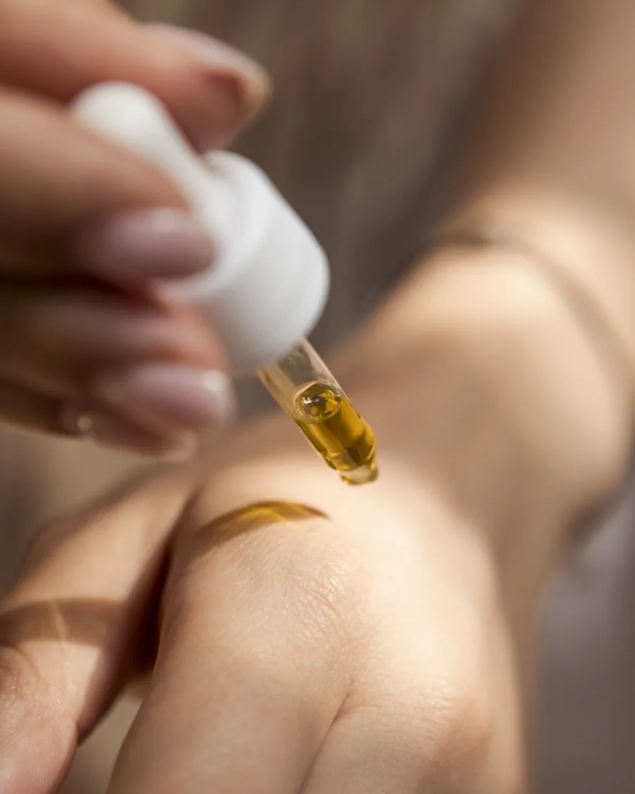 Treatment oil applied to skin