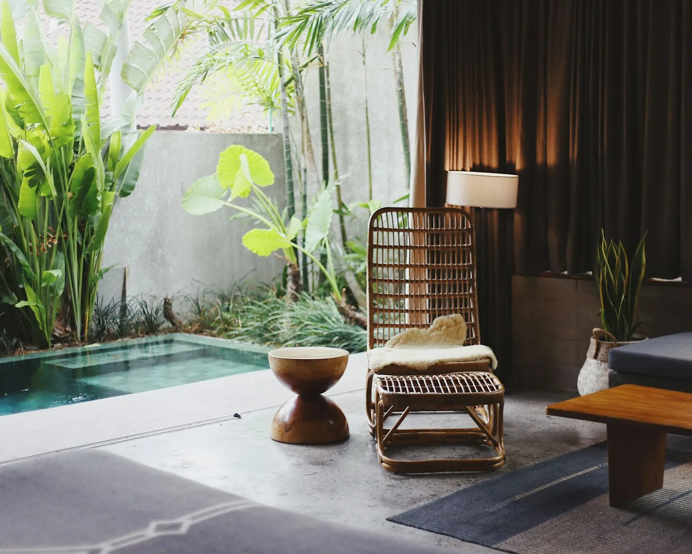 Quiet spa courtyard with plants, loungers and a pool
