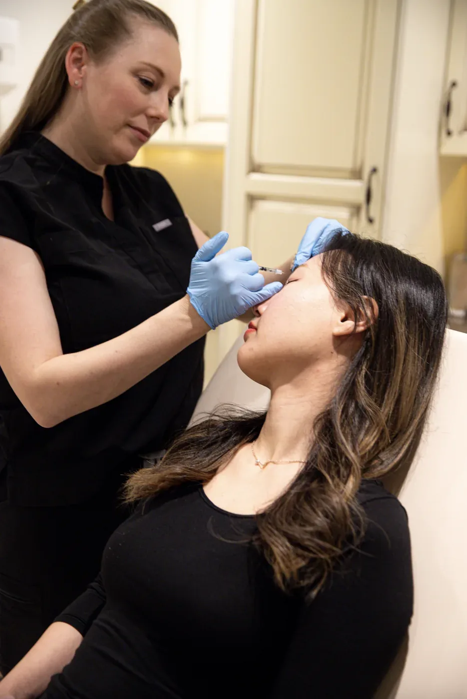 Clinician performing an injectable treatment